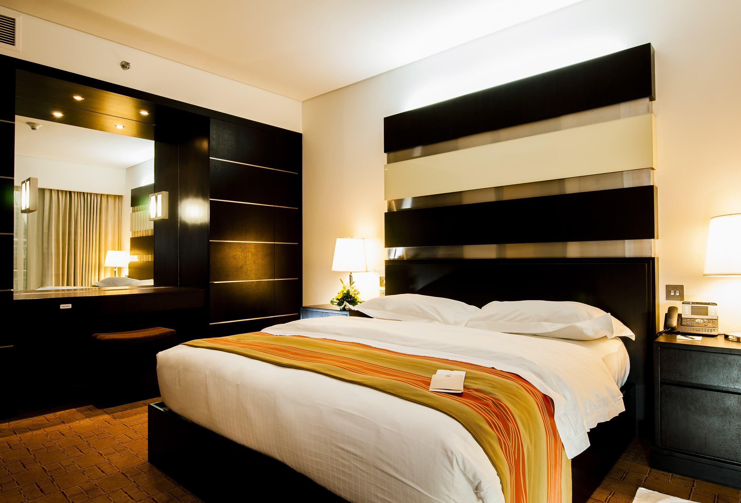 Dubai International Terminal Hotel Exterior foto A bedroom in a hotel